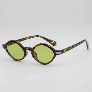 Retro tortoise shell irregular sunglasses with light green lenses and hexagonal metal trim