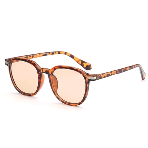 Lunettes de soleil rondes rétro à monture écaillée avec verres teintés orange et métal