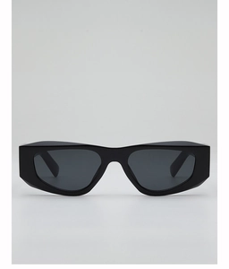 Close-up of black geometric thick frame sunglasses with dark lenses and polished finish
