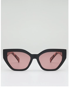 Detail of cat eye sunglasses with black frame and leopard print inner temple design