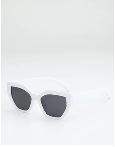 Detail of white chunky irregular cat-eye sunglasses with glossy frame and dark lenses