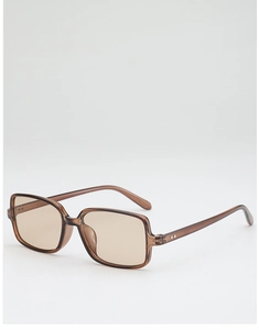 Detail of amber translucent square frame sunglasses with silver rivet accents and tinted lenses