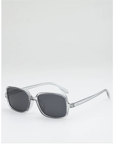 Detail view of transparent grey square sunglasses with model code on the temple