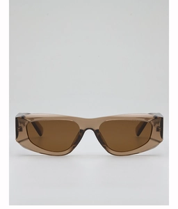 Detail of translucent tea-colored sunglasses with a modern cat-eye polygon frame design