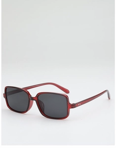 Detail view of retro rectangle sunglasses with square rivets and transparent dark red frame