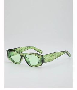 Detail of green marble pattern frame and tinted lens on cat-eye sunglasses