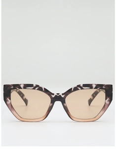 Detailed front view of cat-eye geometric sunglasses with marble texture and amber lenses
