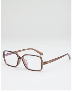 Detail of square tea-colored transparent frame with silver rivet hinges and anti-blue lenses
