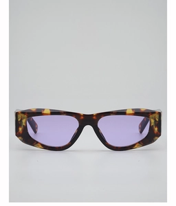 Close-up of tortoise shell polygonal sunglasses with purple translucent lenses