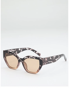 Detail of trendy tortoiseshell cat-eye sunglasses with irregular frames and light brown lenses