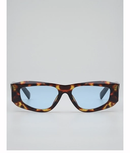 Detail of tortoise shell polygon frame with light blue transparent lenses for trendy sunglasses