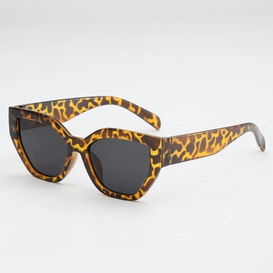 Chic leopard print cat eye sunglasses with thick tortoiseshell frame and dark lenses