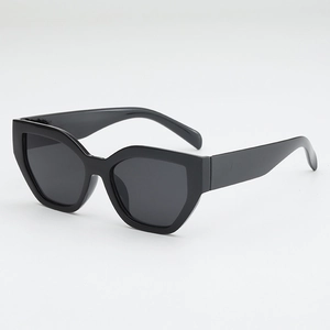Fashionable oversized cat-eye sunglasses with thick black frames and bold geometric temples