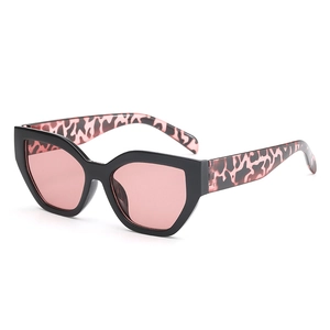 Chic cat-eye sunglasses with black frames, pink lenses, and leopard print temples
