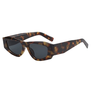 Tortoiseshell geometric sunglasses with dark UV protection lenses in a minimalist style