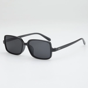 Retro square black sunglasses with silver studs and dark grey lenses for a chic look