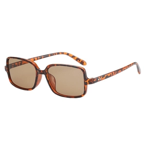 Retro square tortoiseshell sunglasses with brown lenses and twin stud rivets at a 45-degree angle