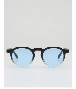 Detail view of retro round sunglasses with gradient frame and light blue ocean lenses