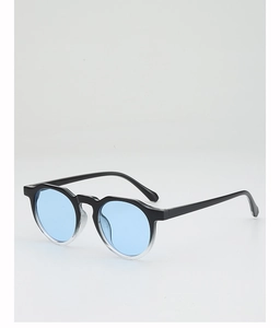 Detail of round frame sunglasses with black to clear gradient and light blue lenses