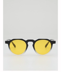 Detail view of retro gradient round frame sunglasses with yellow lenses and keyhole bridge