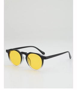 Detail view of round sunglasses with yellow lenses and black-to-clear gradient frames