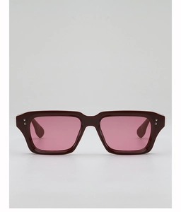 Macro shot of dark burgundy square frames with pink translucent lenses and silver studs