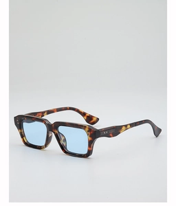 Close-up of vintage tortoiseshell thick frame sunglasses with blue tinted lenses