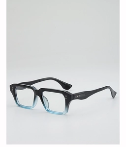 Detail of square glasses with black to blue gradient frames and metallic rivets
