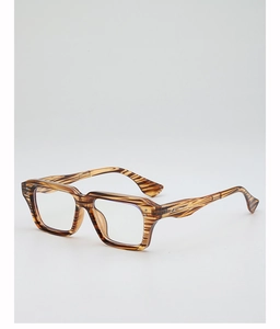 Macro side view of vintage square tiger-patterned glasses frame with silver rivet details