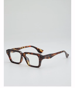 Detailed close-up of retro tortoiseshell thick-frame glasses with decorative metal rivets