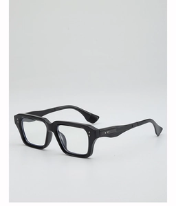 Close-up of black square thick frame glasses with silver rivets and clear lenses