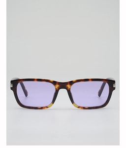 Detail view of retro square sunglasses with tortoiseshell frames and light purple lenses