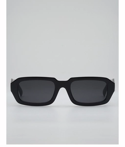 Detail of vintage black rectangle sunglasses with contrasting cream temples and dark lenses