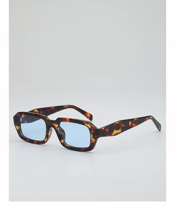 Close-up of vintage tortoise sunglasses with fashion light blue ocean lenses