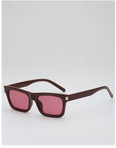 Detail view of rectangular tortoise frame sunglasses with pink lenses and silver corner accents