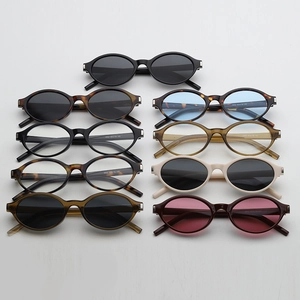 Flat lay of oval vintage sunglasses in nine different colors with high-quality lenses
