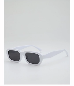 Detail view of bold white rectangular sunglasses with thick frames and dark lenses