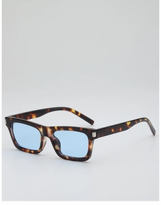Detail of tortoise shell rectangular frame with silver accents and light blue lenses