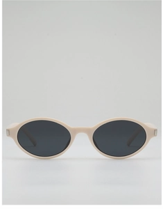 Macro view of oval sunglasses with creamy frame and silver metal temple decoration