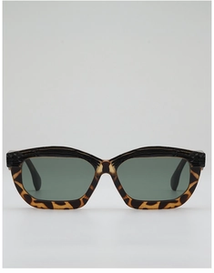Close-up of textured wood grain upper frame and tortoiseshell pattern on sunglasses