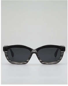 Close-up of irregular black and gray striped frames on retro hip-hop sunglasses
