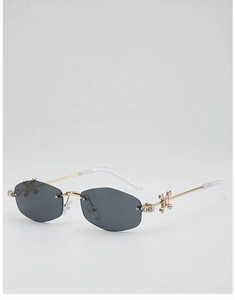 Détails de lunettes de soleil hexagonales sans monture avec charnière dorée et strass rose
