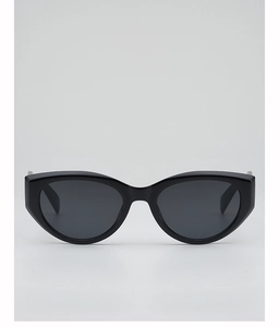 Detailed view of black cat-eye sunglasses with thick glossy frames and dark lenses