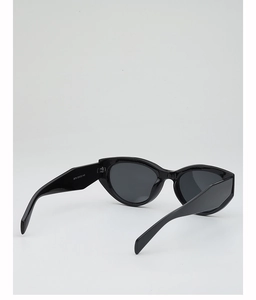 Close-up of black cat-eye sunglasses with wide temples and internal size markings