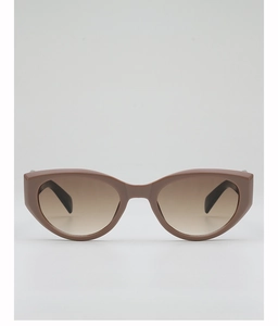 Detail view of cat eye sunglasses with brown tortoiseshell frame and gradient lenses
