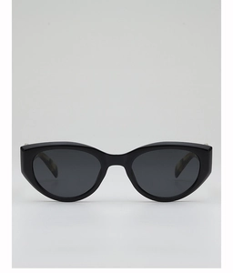 Detailed macro view of black cat-eye sunglasses featuring tortoise pattern inner temple