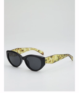Detail of retro cat-eye sunglasses featuring chic marble textured temples and dark lenses