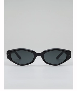 Front detail of black geometric cat-eye sunglasses with silver stud metal accents