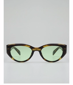 Detail of tortoise shell cat-eye sunglasses with gradient green lenses for women