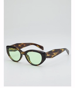 Detail of tortoise shell cat-eye sunglasses with light green translucent lenses